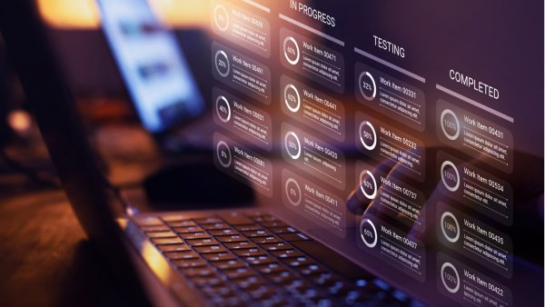 Image of a computer screen showing a project tracking app with tasks in progress, testing, and completed. 