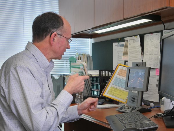 Man sitting at desk.